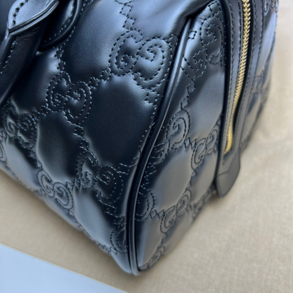G*u*i gg matelassé leather top handle bag